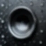 A close-up view of an iPhone speaker with moisture droplets