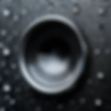 A close-up view of an iPhone speaker with moisture droplets