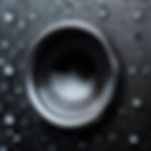 A close-up view of an iPhone speaker with moisture droplets