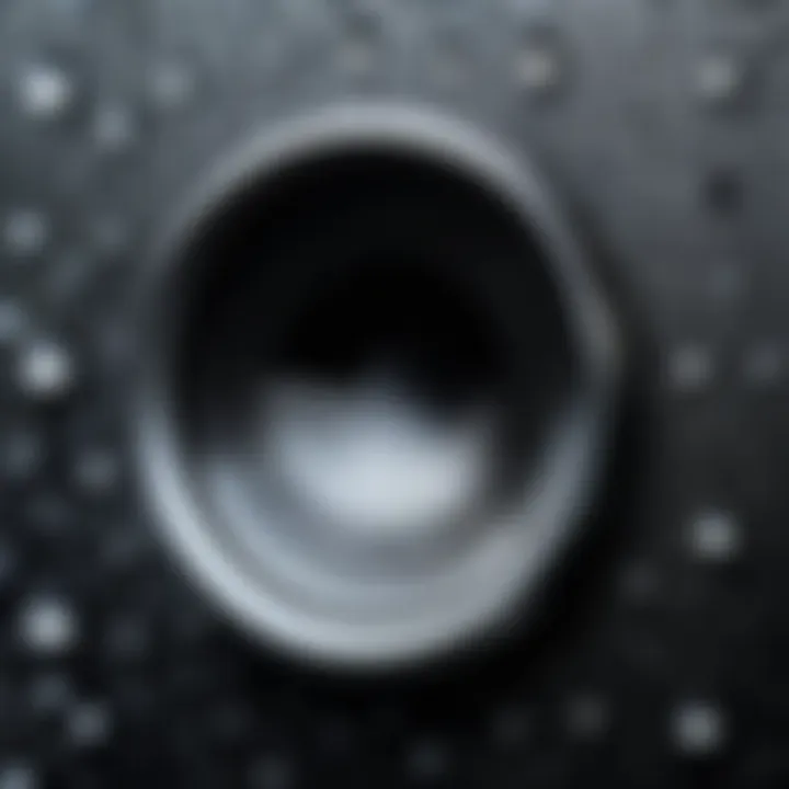 A close-up view of an iPhone speaker with moisture droplets